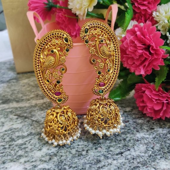 Pretty peacock design gold finish jhumkas.