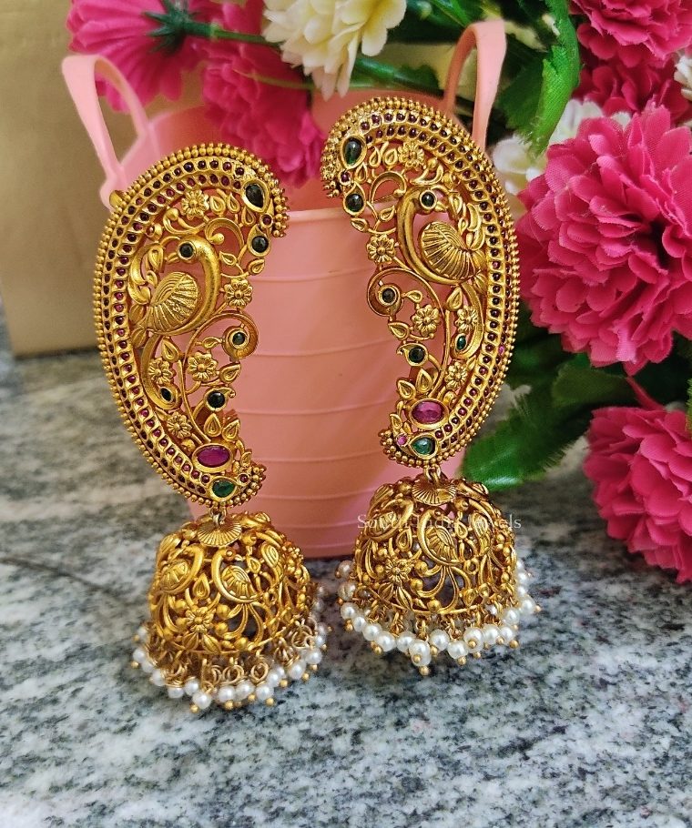 Pretty peacock design gold finish jhumkas.