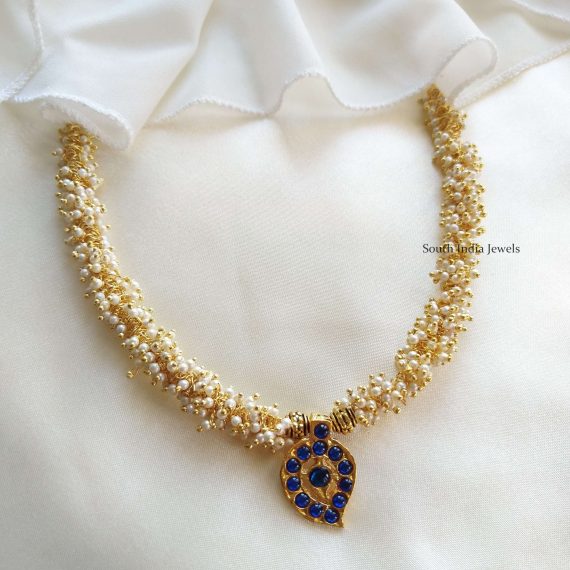 This will be your new favorite to style with sarees. Also shop more Kemp Mango Pendent Necklace at South India Jewels.