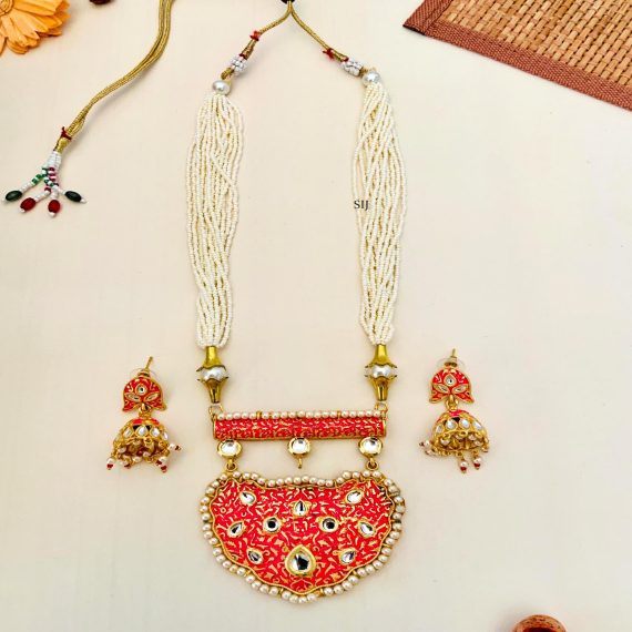 Multi Layers Pearl Beaded Haram with Kundan Studded Orange Pendant