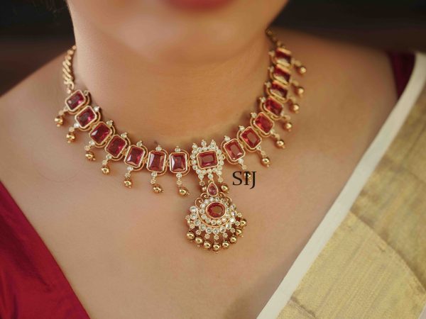 This imitation necklace, adorned with striking ruby stones, is a stunning example of elegant craftsmanship. Designed to emulate the beauty of genuine rubies, the necklace features vibrant stones that exude a rich, luxurious appeal. Perfect for special occasions, this piece adds a touch of sophistication and glamour to any ensemble. Despite being imitation, the necklace captures the timeless allure of ruby jewelry, offering an affordable yet exquisite accessory. Its classic design ensures it will be a treasured addition to your collection, blending beauty with accessibility.